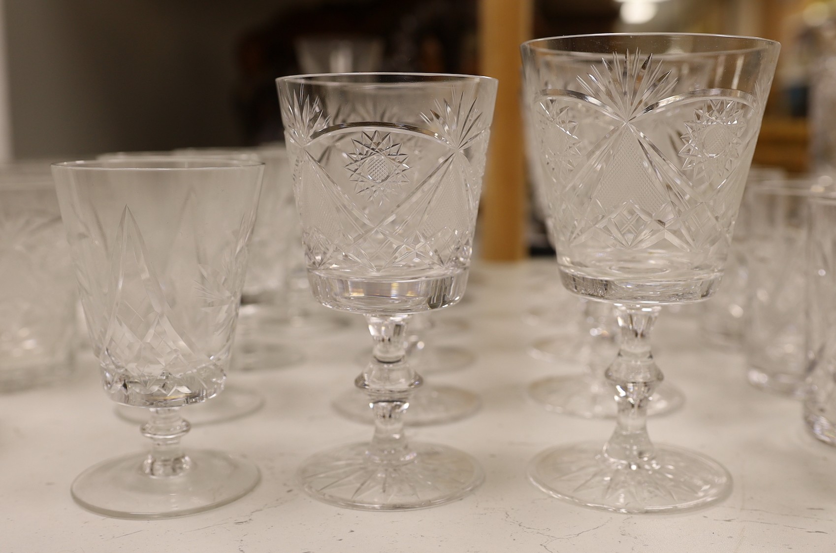 A suite of Hungarian cut drinking glassware, together with other glass